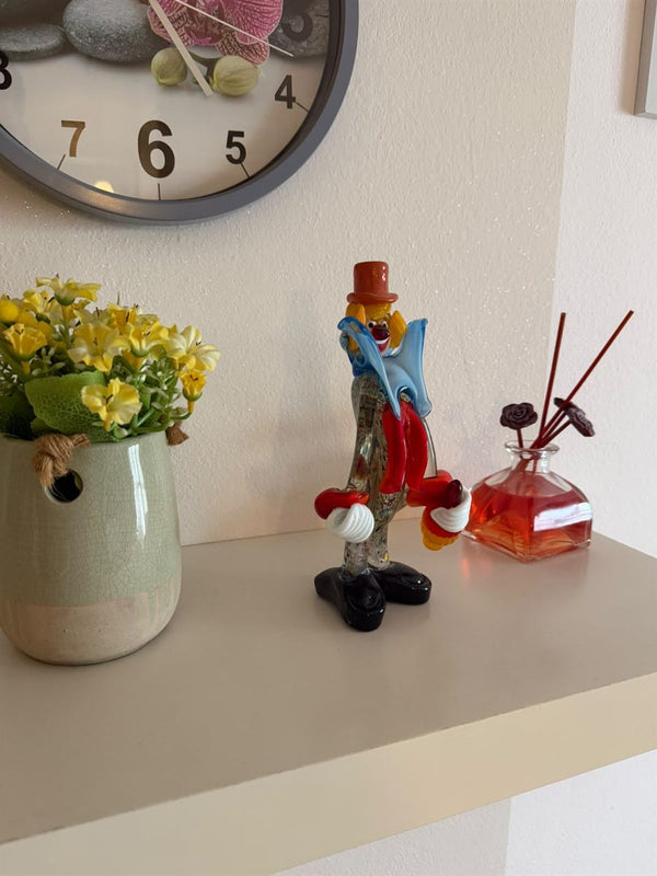 Close-up of the same Murano glass clown in a home interior