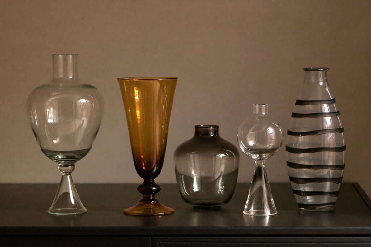Five hand-blown glass vases of different shapes and heights